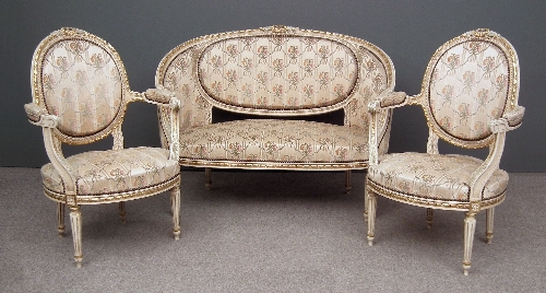 A French cream and gilt decorated