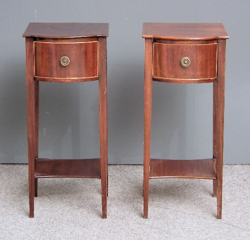 A pair of Edwardian mahogany bow-front