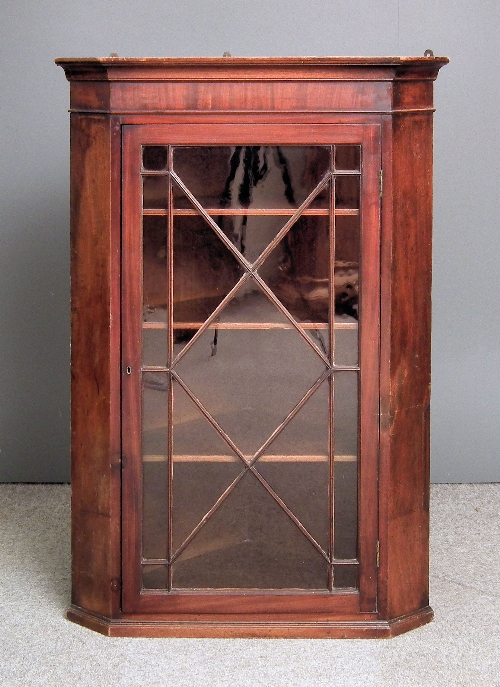 A George III mahogany hanging corner