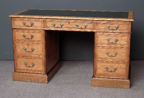 A late Victorian ash kneehole desk