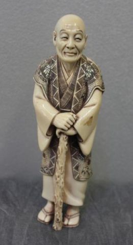 Asian Ivory Figure of a Man with a Walking