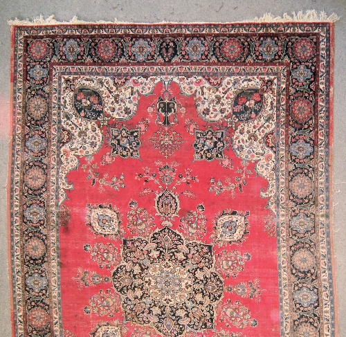 A Meshad carpet woven in colours