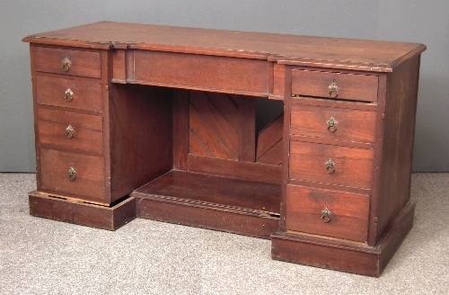 A hardwood kneehole dressing table