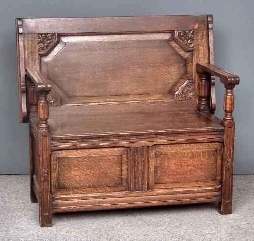 A 20th Century carved oak Monks bench