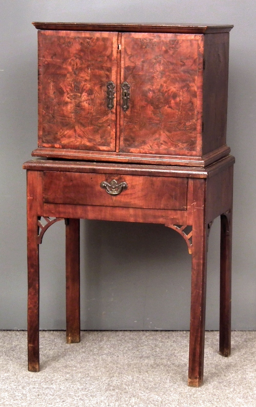 A figured walnut collectors cabinet