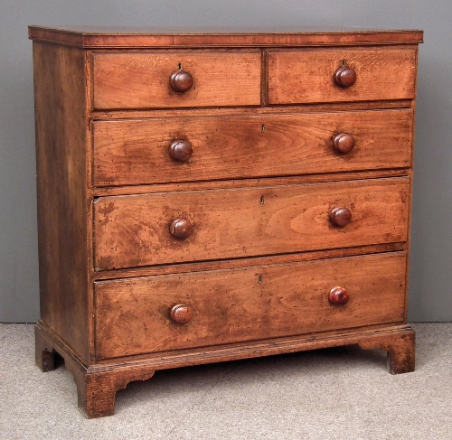 A late Georgian oak chest of drawers
