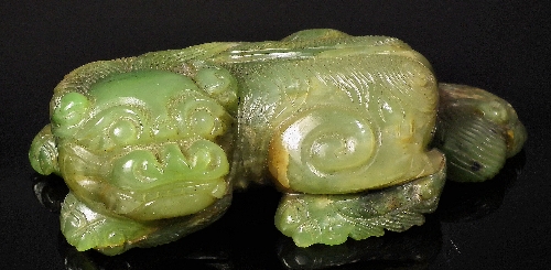 A Chinese spinach green jade carved