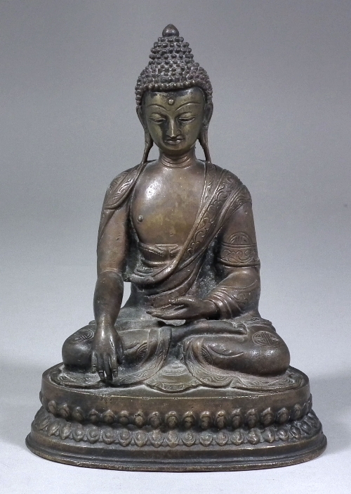 A Siamese patinated bronze figure