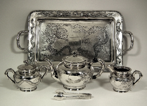 A Chinese silvery metal three piece