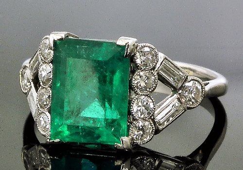 A platinum mounted emerald and