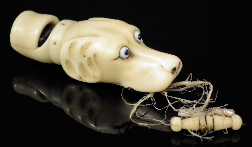 A 19th Century bone dog whistle carved