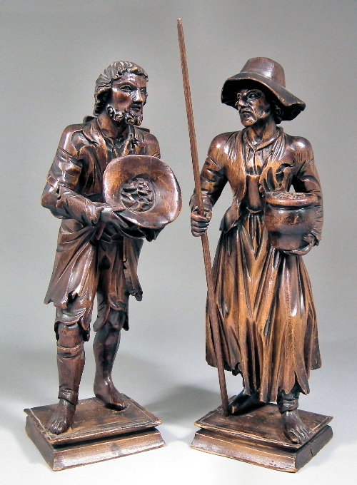 A pair of Continental carved softwood