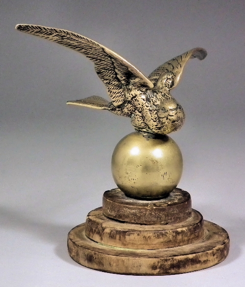 A cast brass car mascot - Swallow