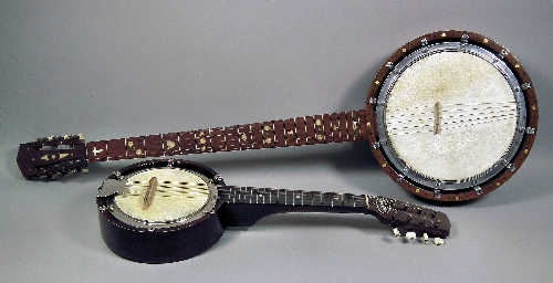 A five string banjo in oak finish