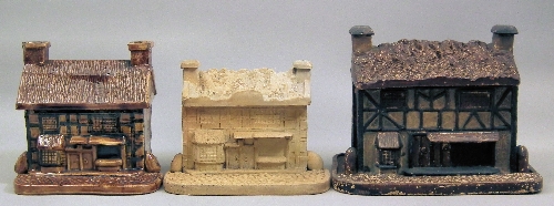 A brown glazed pottery cottage