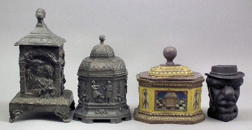 A cast lead square tobacco jar and cover