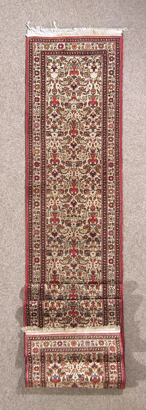 A Hamadan runner woven in colours with