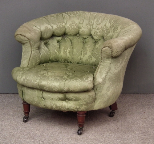 A Victorian tub shaped easy chair