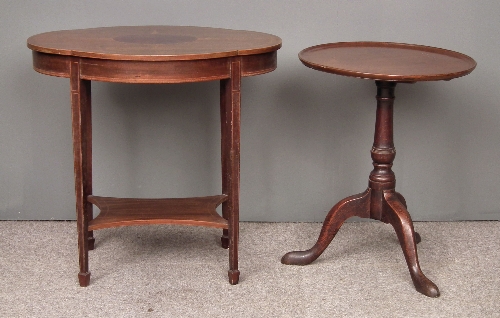 An Edwardian mahogany oval two tier