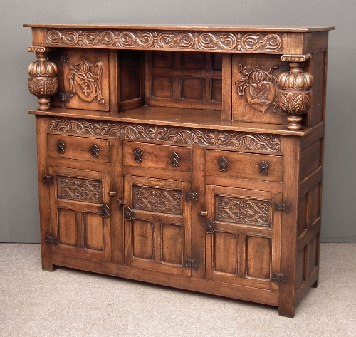 A panelled oak court cupboard of 15d55c