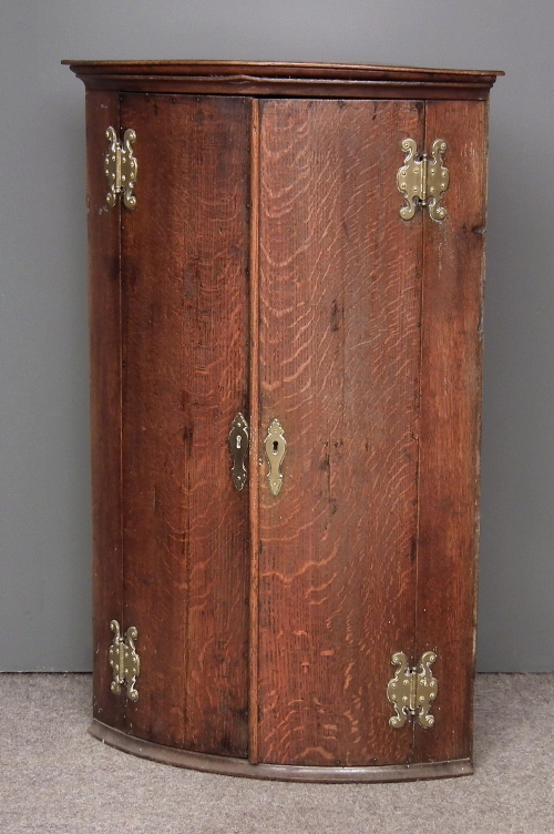 An 18th Century oak bow-fronted