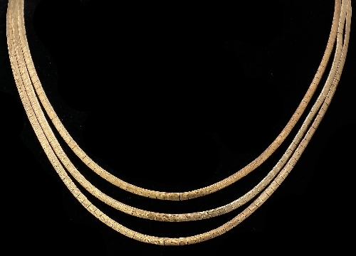 A modern 9ct gold triple strand 15d7f9