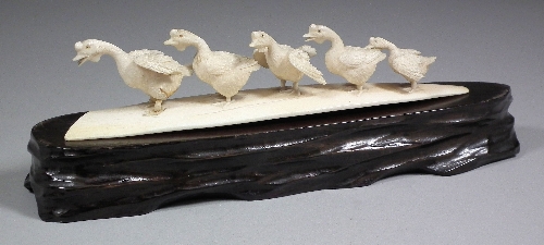 A Japanese carved ivory group of