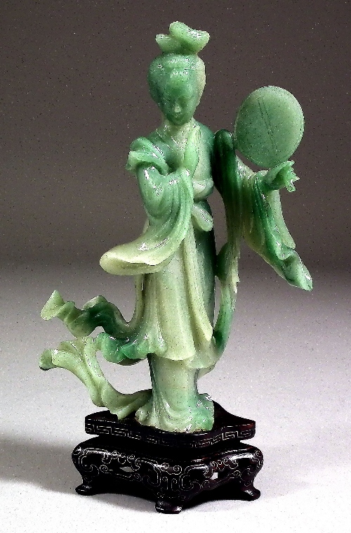 A Chinese green jade standing figure