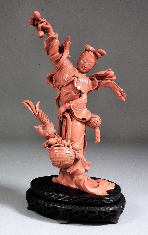 A Chinese carved coral standing