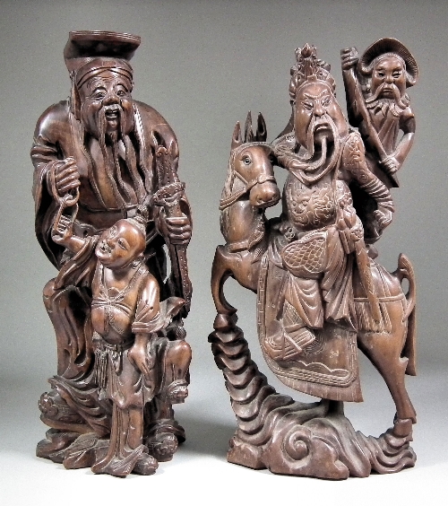 A Chinese hardwood carving of a