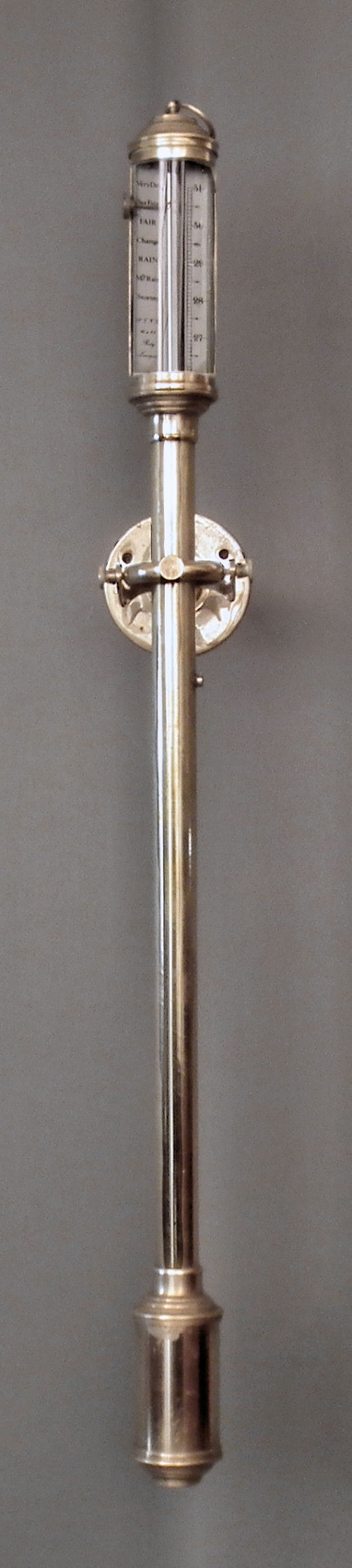 A modern lacquered brass marine barometer