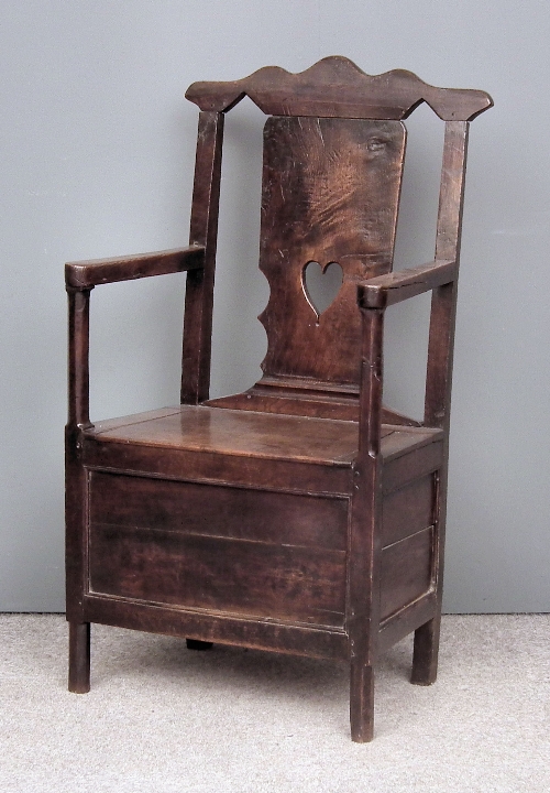 An 18th Century panelled oak commode