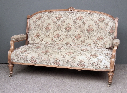 A Victorian walnut three seat settee