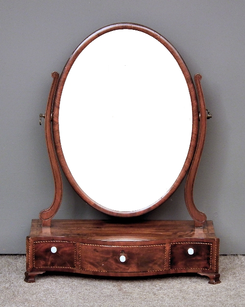 A mahogany oval toilet mirror of