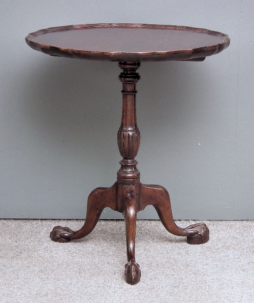 A modern circular tripod table