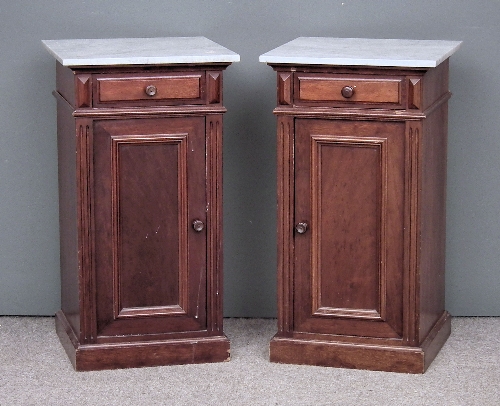 A pair of mahogany bedside cabinets