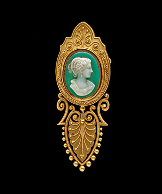 Elaborate Cameo set on a Green