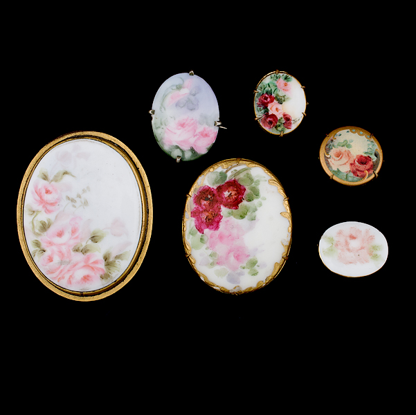 Painted Porcelain brooches A grouping 161431