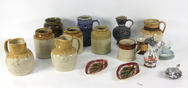 Three stoneware jugs with raised