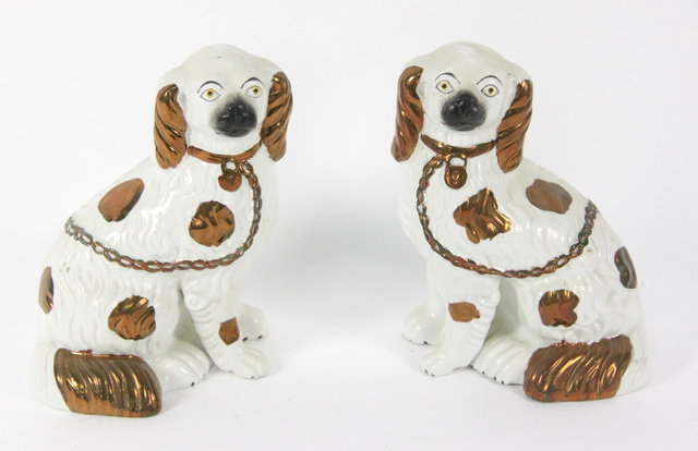A pair of Staffordshire dogs each