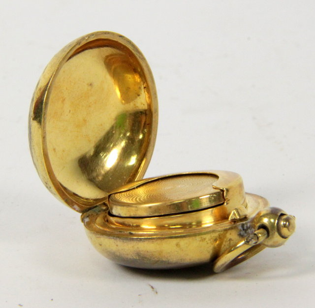 A brass sovereign holder