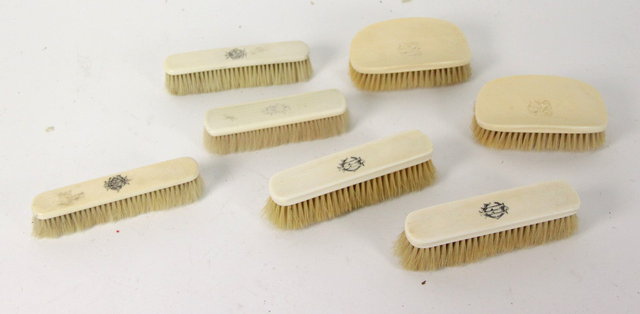 A near set of seven ivory backed hair