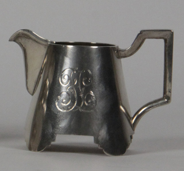 A Russian silver cream jug cyrillic