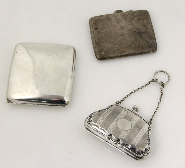 A silver purse Birmingham 1918 and two