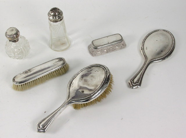 A silver backed three-piece dressing