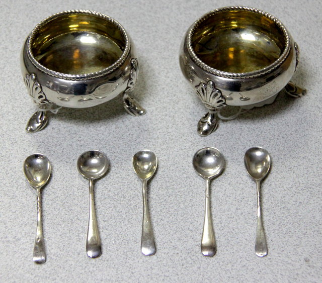 A pair of circular silver salts