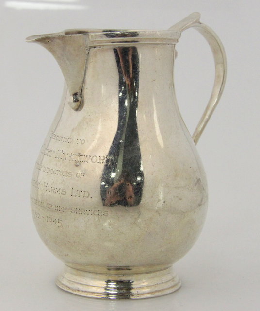 A silver jug Goldsmiths & Silversmiths