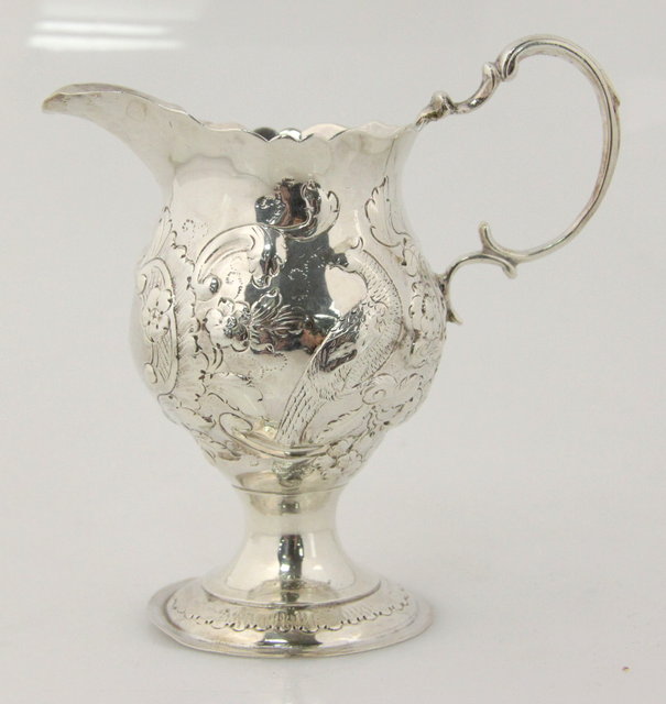 An 18th Century silver jug marks indistinct