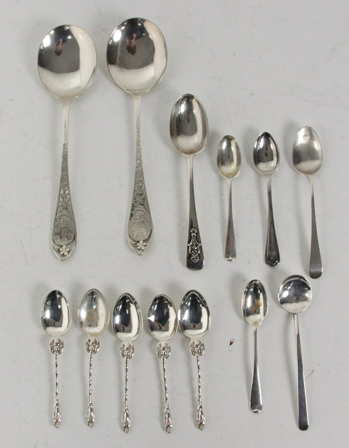 A pair of silver spoons with pierced