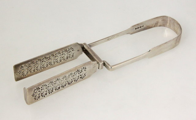 A pair of George IV silver asparagus